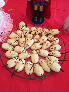 a plate full of cookies with faces on them