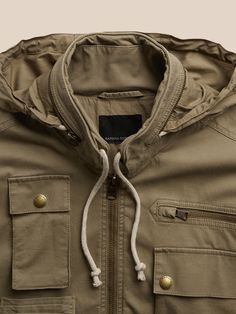 A legend returns from the '90s archives.  This revamped classic has all of the utilitarian features of the original like removable sleeves so you can style as a vest, roomy pockets with snaps and zippers, and an oversized map pocket at back for addit Spring Military Outerwear With Cargo Pockets, Spring Military Outerwear With Multiple Pockets, Khaki Outerwear With Side Pockets For Outdoor, Military Style Outerwear With Pockets For Outdoor, Khaki Windbreaker With Side Pockets For Fall, Khaki Windbreaker With Cargo Pockets For Fall, Military Style Outerwear For Outdoor Activities, Functional Outerwear With Multiple Pockets For Travel, Spring Utility Jacket With Multiple Pockets For Outdoor