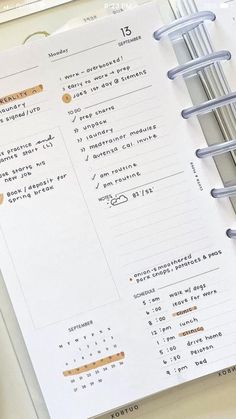 an open planner sitting on top of a desk