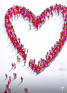 a large group of people standing in the shape of a heart