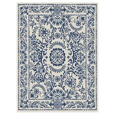 a blue and white rug with an intricate design on the bottom, in front of a white background