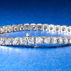 Ross-Simons - 10.00 ct. t. w. Diamond Tennis Bracelet in 14kt White Gold. 7". Classically styled for the ultimate level of sophisticated elegance. This traditional tennis bracelet dazzles with an impressive 10.00 ct. t. w. of round brilliant-cut diamonds, shimmering from end to end in 14kt white gold. An absolute must-have for any fine collection - you will feel such a glow when you try it on. Single-latch safety. Push-button clasp, diamond tennis bracelet. Diamond birthstones are the perfect gi Platinum Tennis Bracelet With 17 Jewels For Anniversary, Exquisite Platinum Tennis Bracelet With Diamond Accents, Formal Platinum Diamond Cut Tennis Bracelet, Classic Platinum Brilliant Cut Tennis Bracelet, Classic Platinum Tennis Bracelet With Brilliant Cut, Luxury Tennis Bracelet With 17 Jewels, Exquisite Formal Tennis Bracelet, Formal Platinum Tennis Bracelet With Diamond Accents, Platinum Tennis Bracelet With Diamond Cut For Anniversary