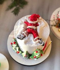 a santa clause cake on a white plate