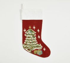 a christmas stocking with a tree and presents on it