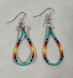 Lightweight beaded earrings that is very versatile. Adjustable Beaded Turquoise Teardrop Earrings, Turquoise Beaded Teardrop Hoop Earrings, Southwestern Dangling Beads For Jewelry Making, Bohemian Adjustable Teardrop Earrings With Colorful Beads, Adjustable Bohemian Teardrop Earrings With Colorful Beads, Tiny Beads Southwestern Jewelry, Dangle Teardrop Earrings With Tiny Beads As Gift, Gift Teardrop Dangle Earrings With Tiny Beads, Adjustable Beaded Dangle Hoop Earrings