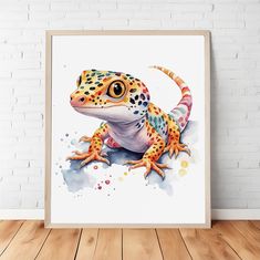 a colorful gecko sitting on top of a wooden floor