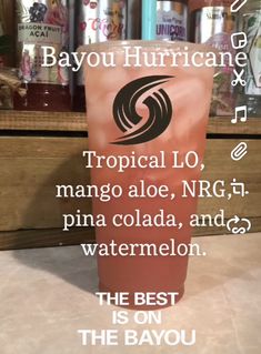 a coffee cup with the words tropical lo, mango aloe, n r g, pina cola, and watermelon