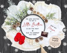 the birth announcement is displayed on a white doily with snowflakes and pine cones