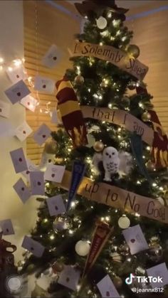 a decorated christmas tree with harry potter themed decorations