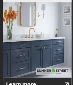 a bathroom with blue cabinets and marble counter tops is featured in the summer street magazine