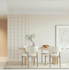 a dining room with white chairs and a table