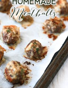 homemade meatballs on a baking sheet with chopsticks in the background and text overlay that says homemade meatballs