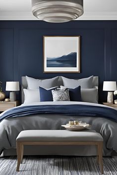 a bedroom with blue walls and gray bedding