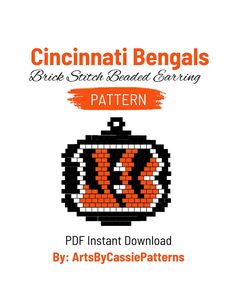 an orange and black clock with the words cincinnati bengals written on it in white