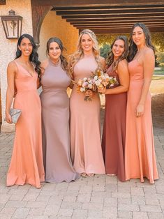 the bridesmaids are all wearing different colored dresses