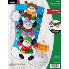 a christmas stocking with two snowmen and a sign that says snow much fun