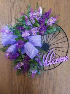 a purple wreath with the word welcome on it