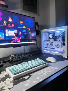 a desk with a keyboard, mouse and monitor on it in front of the screen