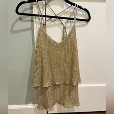 Taupe And Gold Metallic Material With A Layered Ruffle Front And Strappy Back. Never Worn. Tags Still On. Very Flowy Fit. Looks Great With Dark Jeans Or Black Leather Pants. Wear Tucked In Or Out. I Offer A Discount For Multiple Items. Message Me For More Information Or Make An Offer. Red Camisole, Party Tank Top, Floral Cami Top, Tiered Tops, Floral Cami, Black Leather Pants, Black Camisole, Spaghetti Strap Tank Top, Paper Crane