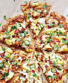 a pizza with many toppings cut into eight slices