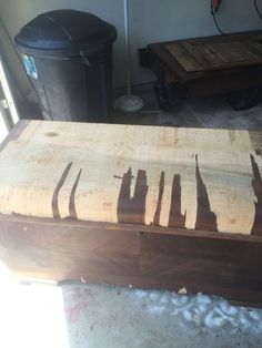 a large wooden box sitting on top of a floor