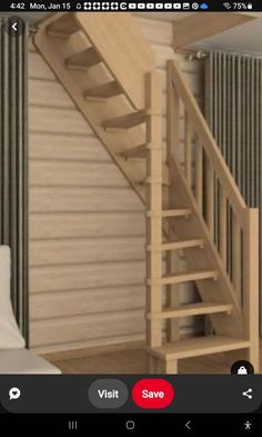 a wooden staircase next to a bed in a room