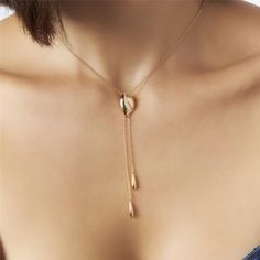 Introducing our 18K Gold-Plated Tie Necklace with Zirconias — a statement of refined elegance and timeless glamour. Versatile and chic, this piece effortlessly elevates any ensemble, making it the perfect accessory for both casual and formal occasions. 15.75in + 2in extender 40CM + 5CM Luxury White Lariat Necklace For Gift, Chic Wedding Clavicle Chain Jewelry, Gold-tone Clavicle Chain Jewelry For Wedding, Chic Formal Jewelry With Adjustable Chain, Elegant Formal Choker Necklace, Chic Clavicle Chain Pendant Jewelry, Chic Clavicle Pendant Jewelry, Elegant Adjustable Clavicle Chain Jewelry, Elegant Adjustable Clavicle Chain