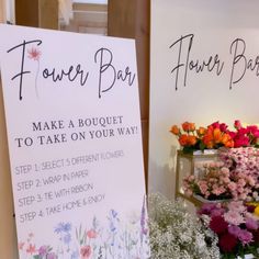 flower bar sign next to flowers on display