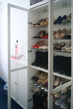 the closet is filled with many pairs of shoes