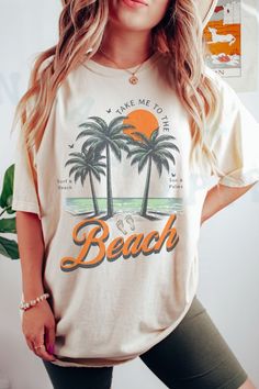 Take Me To The Beach Summer Retro Vintage Style Top Palm Trees And Sun Beach Lovers Tee. Distressed Beach Scene Graphic T-shirt. Short Sleeve Graphic Print Tops For Summer, Graphic Print Short Sleeve Tops For Summer, Beachy Tops For Beach Season, Graphic Tee With Letter Print For Summer, Crew Neck Tops For Beach Season Summer Activities, Summer T-shirt For Beach Season Activities, Graphic Tee For Summer Activities, Graphic Print Graphic Tee Tops For Summer Activities, Graphic Tee Tops With Graphic Print For Summer Activities