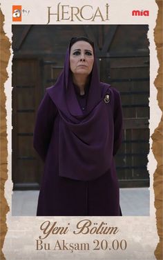 a woman wearing a purple hijab is standing in front of a wooden frame