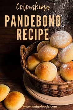 a basket filled with powdered donuts on top of a wooden table