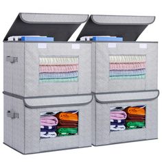 two large storage bins filled with clothes