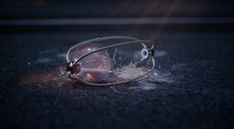 a pair of glasses laying on the ground