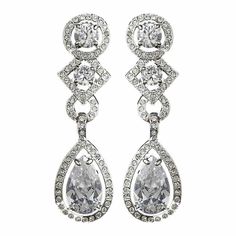 CZ Bridal and Formal Earrings Add a glamorous touch to your wedding day or special occasion with these sparkling cz earrings. These beautiful cubic zirconia bridal earrings will add lots of sparkle to your bridal look. Available in both pierced and clip on styles, these earrings will be perfect for your special day. Color: Silver plated setting/clear stones. Size: 1.75" long and .5" wide. Style: 3824. Please allow 1 week for delivery. Shipping Policy . Return Policy Glamorous Wedding Diamond Earrings With Diamond Accents, Glamorous Diamond Earrings For Wedding, Glamorous Diamond Wedding Earrings, Glamorous Wedding Diamond Earrings With Accents, Glamorous Diamond Earrings With Sparkling Stones For Wedding, Wedding Cubic Zirconia Earrings With Diamond Accents, Glamorous Bridal Earrings With Diamond Accents For Anniversary, Glamorous Cubic Zirconia Chandelier Earrings For Anniversary, Dazzling Diamond Earrings For Wedding