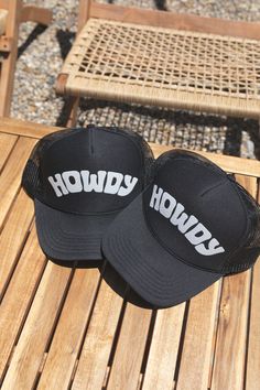 Howdy Trucker Hat on bench Customizable Black Trucker Hat For Streetwear, Customizable Trucker Hat For Streetwear, Customizable Snapback Trucker Hat For Streetwear, Customizable Adjustable Trucker Hat For Streetwear, Hip Hop Trucker Hat With Letter Print, Customizable Snapback Hat For Streetwear, 5-panel Trucker Hat With Letter Print, Adjustable Trucker Hat With Letter Print For Streetwear, Adjustable Letter Print Trucker Hat For Streetwear