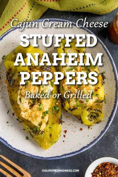 a white plate topped with stuffed anaheim peppers next to a bowl of chili