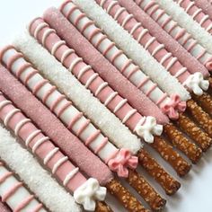 pink and white candy sticks lined up in rows