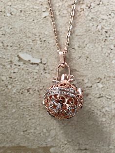 Essential Oil Necklace. Beautiful rose gold rhinestone essential Oil Locket measuring 30mm. Comes with 3 10mm round lava stones for you to diffuse your favorite essential oil.  Necklace measures 18 inches. GIFT BOXED Rose Gold Metal Charm Necklaces, Rose Gold Metal Round Charm Necklaces, Rose Gold Round Metal Charm Necklaces, Rose Gold Round Metal Charm Necklace, Rose Gold Metal Locket Jewelry, Essential Oil Necklaces, Aromatherapy Jewelry, Diffuser Necklace, Emerald Pendant