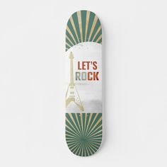 a skateboard with the words let's rock on it and an eiffel tower