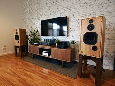 a living room with speakers and a television