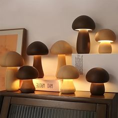 several mushrooms are lit up on a shelf