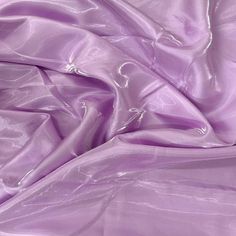 This exquisite bridal satin fabric is designed to captivate with its unique crystalized reflection that shimmers beautifully as light hits from various angles. Item offers a soft and smooth finish while feeling silky to the skin. Perfect for creating stunning bridal gowns, elegant evening wear, or high-end décor, its breathtaking luster and fluid drape elevate any project. The true beauty of this fabric is unmatched in photographs--it must be seen in person to truly appreciate its mesmerizing brilliance. Image may look different due to setting on monitor screen. Item is sold by the yard.If more than one yard is ordered, item will come in one piece. For instance, if you order one yard, you will receive a piece of 59" x 36" and if you order two yards, you will receive a piece of 59" x 72" et Elegant Evening Wear, Gowns Elegant, Glitter Decor, Purple Crystal, Muslin Fabric, Purple Crystals, Lavender Purple, Felt Fabric, Lace Knitting