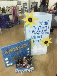 two boxes that are on the floor in a store, one with an angelica sign