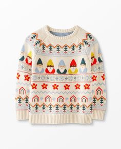 an image of a sweater with trees and snowflakes on the front, against a white background