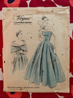 "Original vintage sewing pattern : Vogue Couturier Design 778; ©1953; ONE PIECE DRESS AND CAPE. Bare-top princess dress with an inverted pleat at centre-front and centre-back, below the waist-line. Off-the-shoulder cape with rolled collar, fastens with a single button at centre-front. Featured in Vogue Pattern Book, February-March 1954 Bust 36\" Pattern pieces: unprinted and complete Instructions: yes Envelope condition: good for age, envelope is worn and split across the bottom Stored and shipp Vintage Fashion Sketches, 1950s Sewing Patterns, Vintage Vogue Sewing Patterns, Dress Cape, Vogue Vintage, Evening Dress Floor Length, Vintage Dress Patterns, Vogue Sewing, Vogue Sewing Patterns