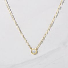 Super dainty, cubic zirconia solitaire necklace. We use highest grade CZs for an authentic diamond look! It looks like a genuine diamond necklace! * Made of 925 Sterling Silver * We use a THICK, DURABLE plating of 14K Gold or Rhodium - for a piece that will last you years to come! * Chain measures 16" + 3" Extension * Highest Grade CZ for an authentic diamond look! * Nickel-free & Hypoallergenic * Dimensions: 6 mm ( .25" ) Gold Solitaire Necklace In Sterling Silver, Everyday Cubic Zirconia Diamond Necklace With Bezel Setting, Minimalist Cubic Zirconia Necklace With Bezel Setting, Dainty Cubic Zirconia Necklace With Bezel Setting, Delicate Cubic Zirconia Necklace With Bezel Setting, Dainty Solitaire Necklace With Diamond Accents In Cubic Zirconia, Everyday Cubic Zirconia Solitaire Necklace, Dainty Yellow Gold Solitaire Necklace With Cubic Zirconia, Dainty Cubic Zirconia Solitaire Necklace