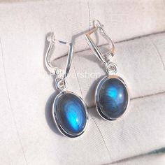 Natural Blue Labradorite Oval Gemstone 925 Sterling Silver Earrings Handmade Jewelry gift for women Desc : Metal : Solid 925 Sterling Silver Type : Dangle Earrings Stone : Labradorite Stone Size : 10x14 mm Stone Shape : Oval Healing Properties Labradorite : Labradorite is a stone of transformation, helping to relieve tension and stress. It is also used as an aid in spiritual growth by acting as a prism for the seven rays from the energy field, allowing them to align with one's own. Purple Labrad Elegant Labradorite Dangle Earrings, Elegant Nickel-free Labradorite Earrings, Elegant Labradorite Drop Earrings, Elegant Labradorite Jewelry For Pierced Ears, Labradorite Earrings For Pierced Ears As Gift, Elegant Handmade Labradorite Earrings, Silver Labradorite Gemstone Earrings, Gift Labradorite Earrings, Gemstone Labradorite Earrings