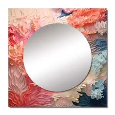 a round mirror sitting on top of a wall covered in colorful paper flowers and leaves