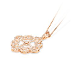 This detailed filigree pendant, resembles feminine strength. Elegant and classic, this filigree pendant is set in 18K rose gold, and features a round cut white diamond, that is placed in the center of the diamond lined, swirly, filigree design. The pendant hangs from a rose gold chain and is attached by an embellished bail at the top of the pendant. This pendant is sure to be adored by all who see it and makes for a beautiful gift.
We are happy to answer any of your questions! Contact us! Feminine Strength, Filigree Pattern, Pave Pendant, Filigree Pendant, Rose Gold Chain, Feather Pendant, Diamond Star, Filigree Design, Ball Pendant